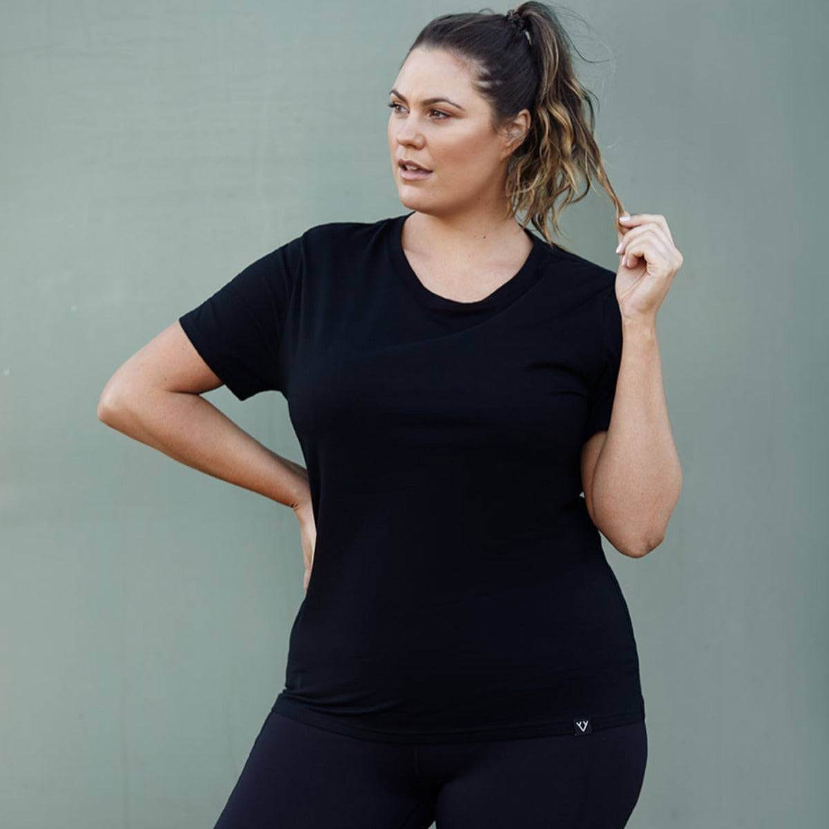 Woman wearing Victoria Stag's Core Trainer Tee in Black