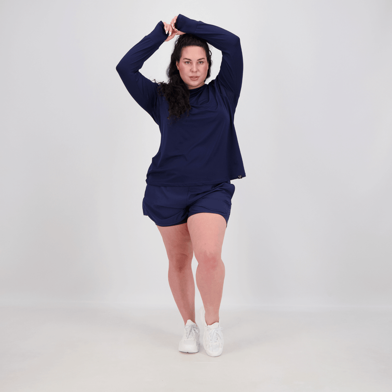 woman wearing navy long sleeve tee with longer length