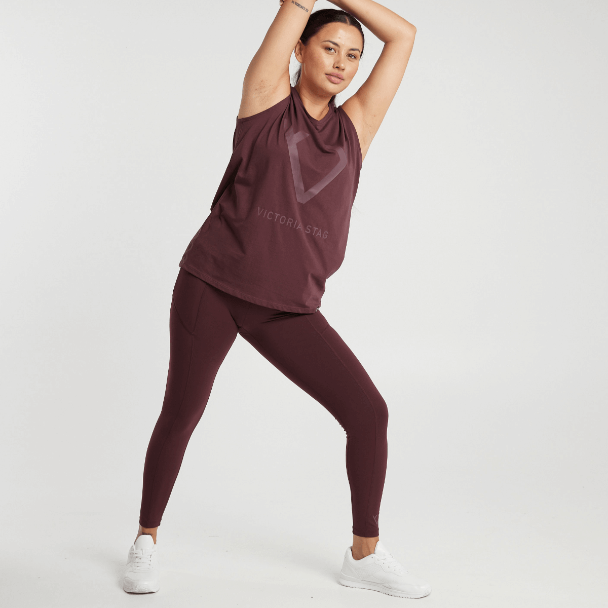 Woman wearing Victoria Stag's Core Full Length Tights in Ox Blood