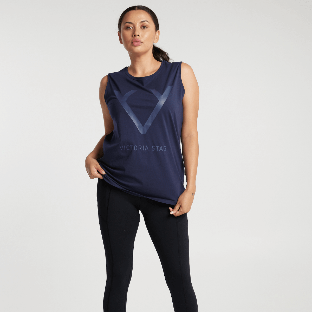 Woman wearing Victoria Stag's Core Muscle Tank in Navy